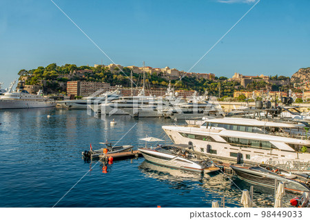Idyllic view of the harbor (Port Hercule) of Monaco with luxury yachts and the skyline of Monaco from the 98449033