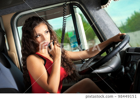 Young attractive girl drive big truck Young attractive girl drive big truck 98449151