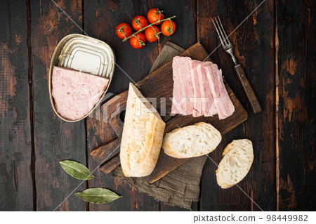 Cooked Ham from the can bread sandwich, on old dark  wooden table background, top view flat lay 98449982