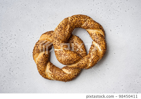 Simit  Turkish fast food bagel , on gray concrete table background, top view flat lay, with copy space for text 98450411