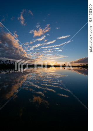 Twilight cloudscape over Pine Glades Lake in Everglades National Park. Twilight cloudscape over Pine Glades Lake in Everglades National Park. 98450500