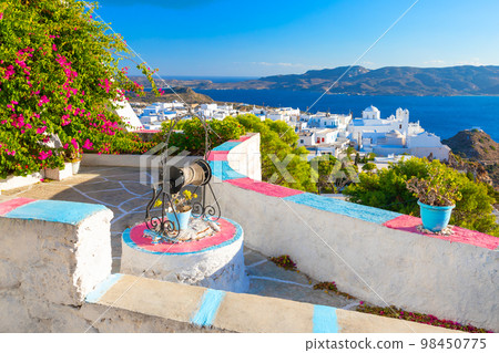 One of the cozy streets of Plaka town. Milos island, Greece 98450775