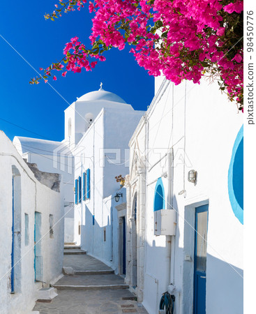 One of the cozy streets of Plaka town. Milos island, Greece 98450776