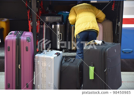 loading luggage on bus 98450985