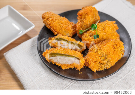 Meat stuffed fried peppers 98452063