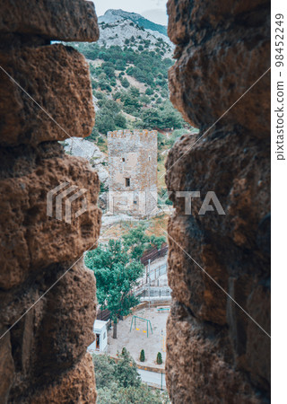 View from an old medieval loophole on tower. 98452249