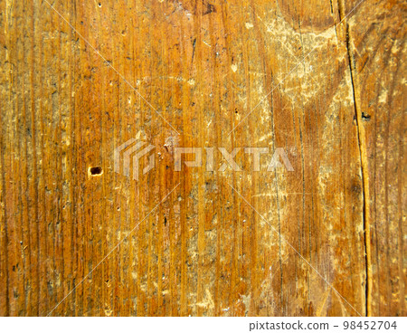 Textured background of an old vintage cracked brown board 98452704
