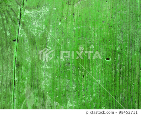 Textured background of an old vintage cracked green board 98452711