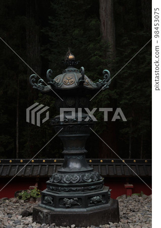 National Treasure Nikko Toshogu Shrine, bronze lanterns with the crest of the Tokugawa family installed throughout the precincts National Treasure Nikko Toshogu Shrine, bronze lanterns with the crest of the Tokugawa family installed throughout the precincts 98453075