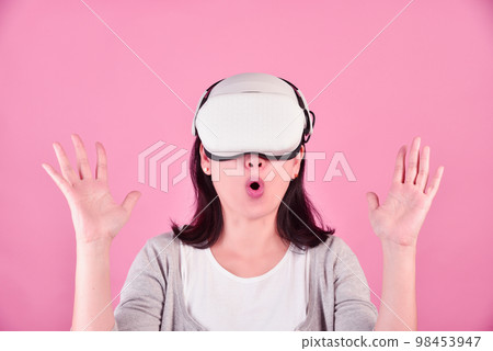 Asian woman using vr glasses, Watching movie and playing video games 98453947