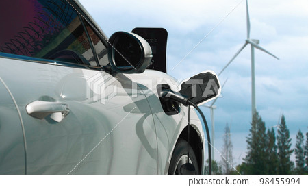 Progressive electric vehicle powered by clean energy generated by wind turbine. 98455994