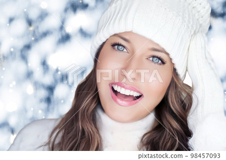 Winter holiday travel, lifestyle and fashion, beautiful happy woman and snowy forest, nature, ski resort and leisure activity outdoors Christmas, New Year and holidays portrait. 98457093