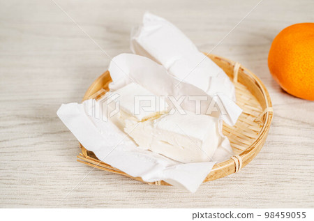 Ice mochi and mandarin oranges on a basket Ice mochi and mandarin oranges on a basket 98459055