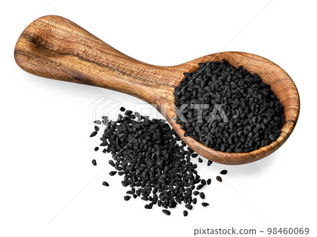 black cumin seeds in round scoop and heap near isolated on white 98460069