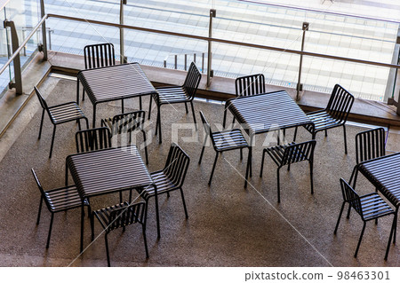 Empty terrace seats in the restaurant on the second floor 98463301