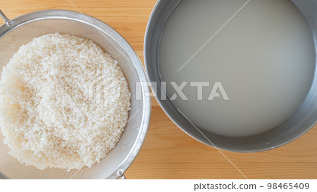 washed white rice and water washed white rice and water 98465409