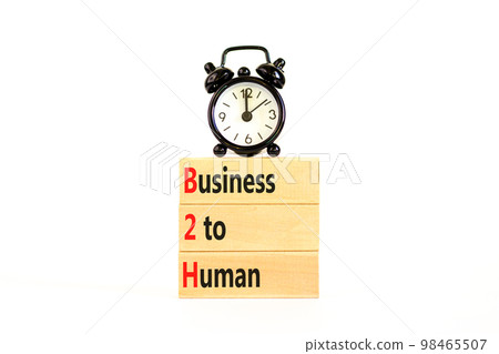 B2H business to human symbol. Concept words B2H business to human on wooden blocks on a beautiful white table white background. Black alarm clock. Business B2H business to human concept. Copy space. B2H business to human symbol. Concept words B2H business to human on wooden blocks on a beautiful white table white background. Black alarm clock. Business B2H business to human concept. Copy space. 98465507