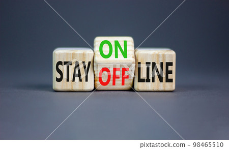 Stay online or offline symbol. Concept word Stay online or offline on wooden cubes. Beautiful grey table grey background. Business and stay online or offline concept. Copy space. Stay online or offline symbol. Concept word Stay online or offline on wooden cubes. Beautiful grey table grey background. Business and stay online or offline concept. Copy space. 98465510