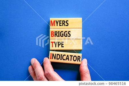 MBTI Myers Briggs type indicator symbol. Concept words MBTI Myers Briggs type indicator on block on beautiful blue background. Psychological MBTI Myers Briggs type indicator concept. Copy space 98465516