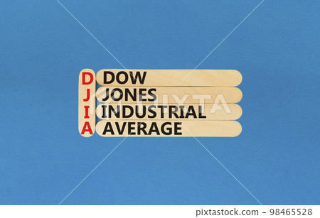 DJIA Dow Jones industrial average symbol. Concept words DJIA Dow Jones industrial average on wooden stick on beautiful blue background. Business DJIA Dow Jones industrial average concept. Copy space. 98465528
