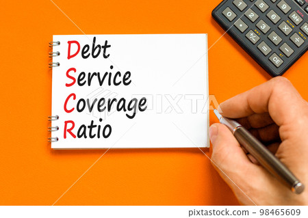 DSCR debt service coverage ratio symbol. Concept words DSCR debt service coverage ratio on white note on beautiful orange background. Business DSCR debt service coverage ratio concept. Copy space. DSCR debt service coverage ratio symbol. Concept words DSCR debt service coverage ratio on white note on beautiful orange background. Business DSCR debt service coverage ratio concept. Copy space. 98465609