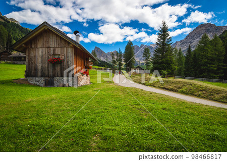 Cute wooden huts in the stunning San Nicolo valley, Dolomites Cute wooden huts in the stunning San Nicolo valley, Dolomites 98466817