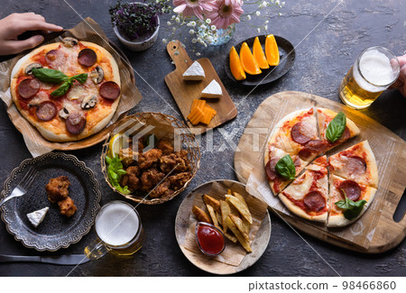 A meal of pizza and beer 98466860