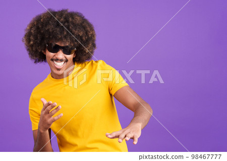African man with curly hair rapping in sunglasses 98467777
