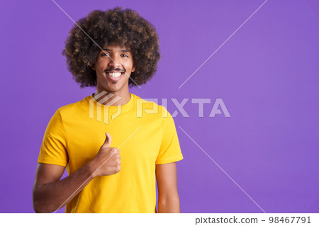 Happy african man gesturing agreement raising a thumb up 98467791