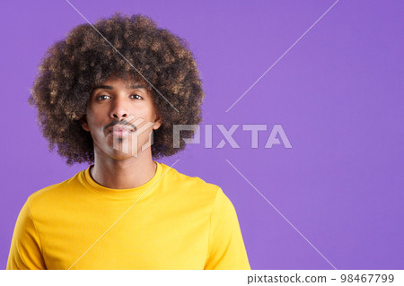 African man looking at the camera with a serious look African man looking at the camera with a serious look 98467799