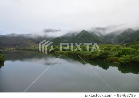 A rainy morning in the summer of 2022, scenery from the train window from Saiki Station to Nobeoka Station on the Nippo Main Line 98468789