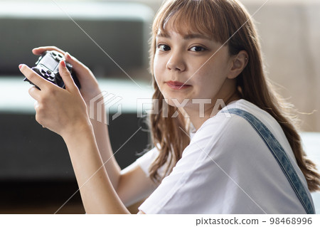 enjoy video games in one's room 98468996
