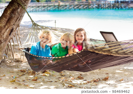 Kids in hammock. Children at tropical beach. Kids in hammock. Children at tropical beach. 98469462