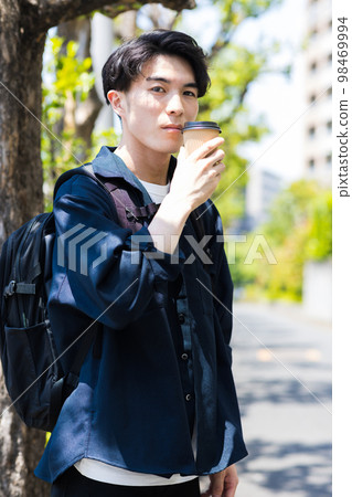 man drinking coffee in the city man drinking coffee in the city 98469994