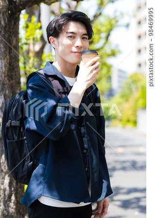 man drinking coffee in the city man drinking coffee in the city 98469995