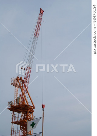 Crane at condominium construction site 98470154