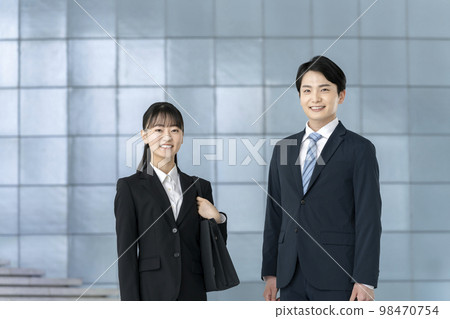 Young men and women in suits looking at the camera with a smile Image of job-hunting students and new members of society 98470754