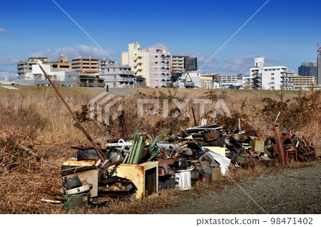 Illegal dumping of riverbed Illegal dumping of riverbed 98471402