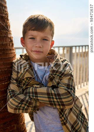 Portrait of a sad boy on a sunny day Portrait of a sad boy on a sunny day 98471637
