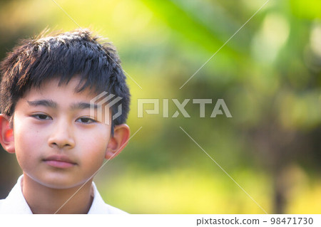 A juvenile boy 98471730