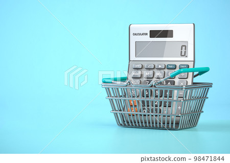 Calculator in shopping basket. Home budget, savings, inflation and consumerism concept Calculator in shopping basket. Home budget, savings, inflation and consumerism concept 98471844