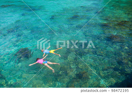 Kids snorkel. Children snorkeling in tropical sea. Kids snorkel. Children snorkeling in tropical sea. 98472195