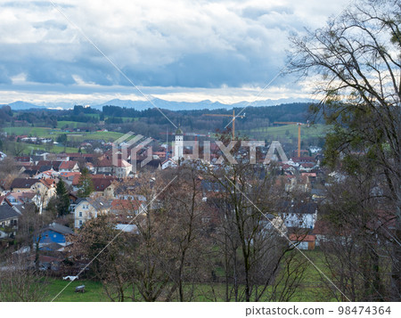 Andechs, Germany - December 27th 2022: View from the monastery hill towards the village and the Alps 98474364