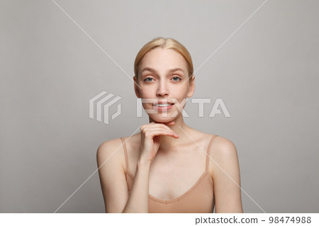 Spa woman smiling on white background. Facial treatment, cosmetology, skincare and beauty concept 98474988