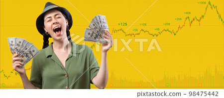 Web banner of stock market trading. Happy screaming Caucasian woman wearing straw hat and holding a fan of dollar currency. Yellow background with copy space and chart. The concept of investment Web banner of stock market trading. Happy screaming Caucasian woman wearing straw hat and holding a fan of dollar currency. Yellow background with copy space and chart. The concept of investment 98475442