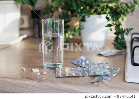 pills and vitamins on table, drink omega and oil in morning, maintaining health pills and vitamins on table, drink omega and oil in morning, maintaining health 98476141