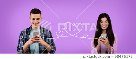 Romantic Millennial Couple Texting On Smartphones Connected With Drawn Heart Shape String Romantic Millennial Couple Texting On Smartphones Connected With Drawn Heart Shape String 98476172