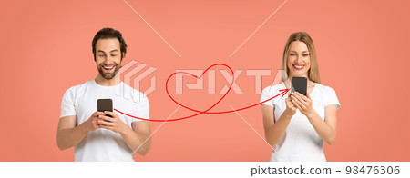 Romantic Man With Smartphone Sending Love Message To His Girlfriend Romantic Man With Smartphone Sending Love Message To His Girlfriend 98476306