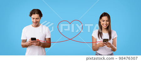 Young Couple Texting On Smartphones Connected With Drawn Red Heart Shape String Young Couple Texting On Smartphones Connected With Drawn Red Heart Shape String 98476307