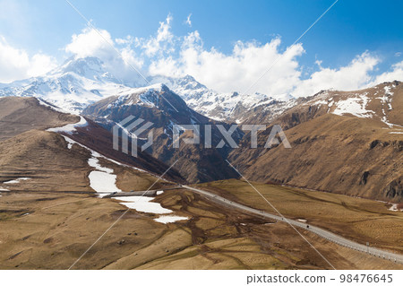 Caucasus, Kazbegi. Georgian landscape with mountain road Caucasus, Kazbegi. Georgian landscape with mountain road 98476645